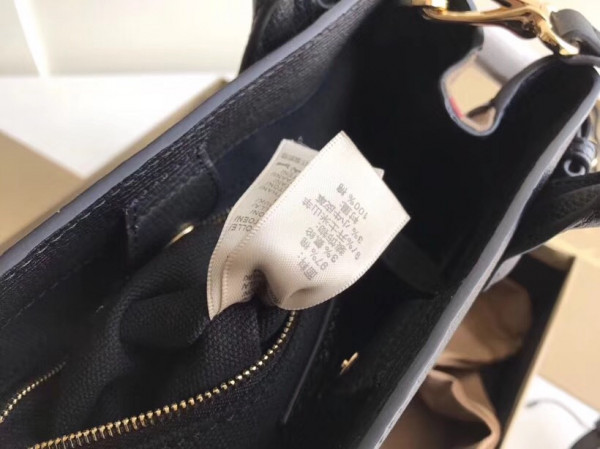 B**rry the small banner in leather and house check