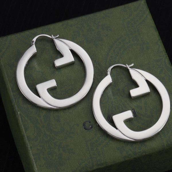 G*u*i earrings